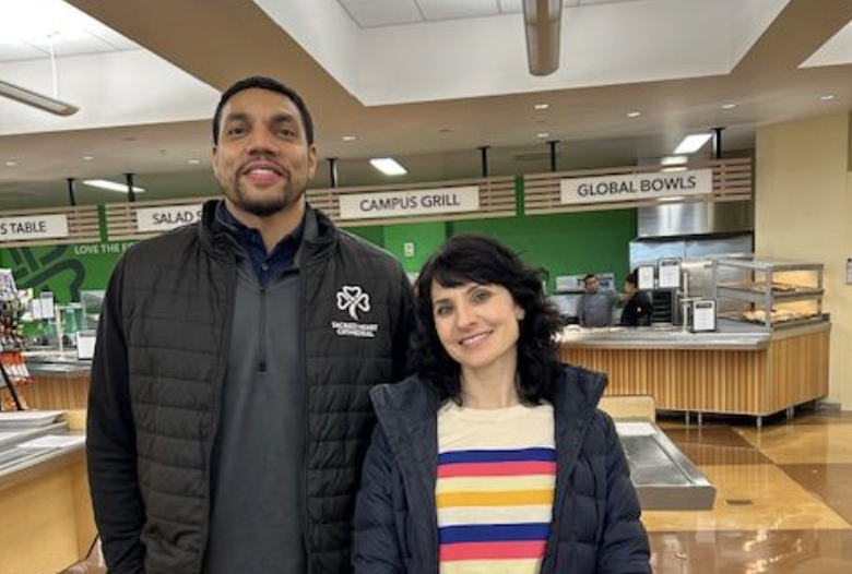 Ms. Nastari and Coach Carey posing together in the Dining Hall. 